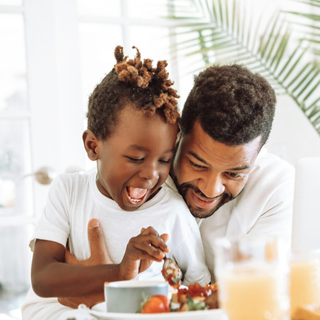 dad and son eating breakfast