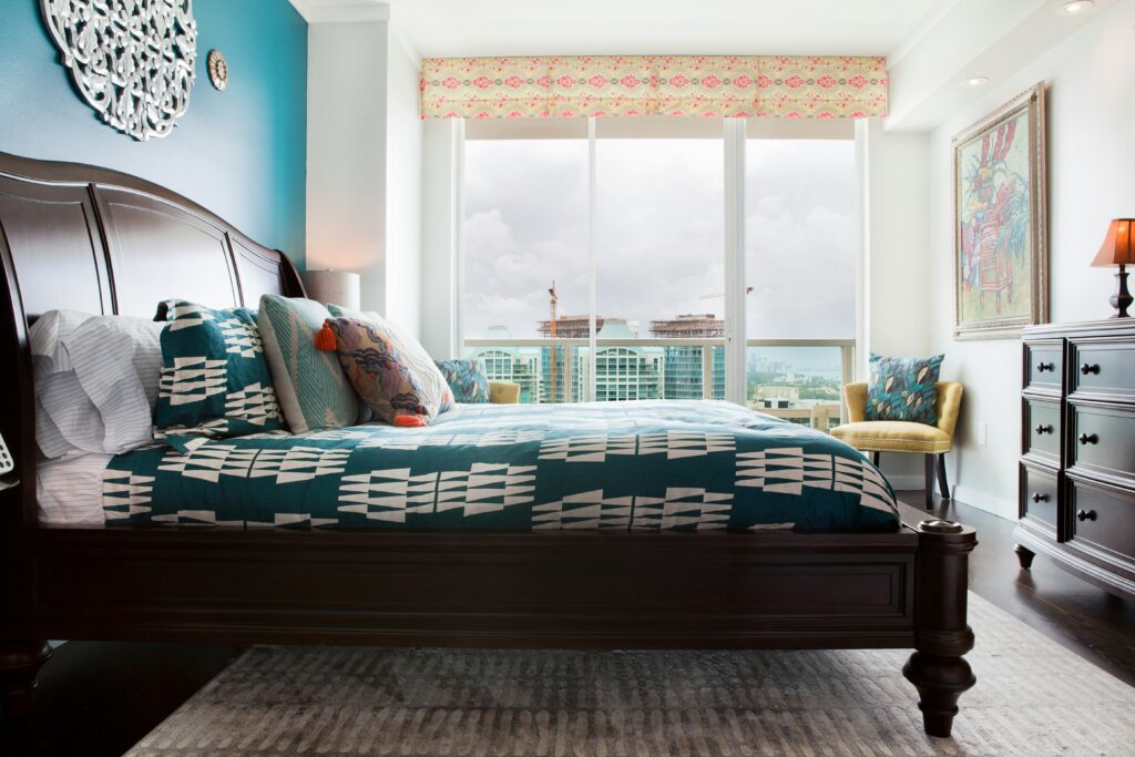 bedroom with a bed, dresser and chair